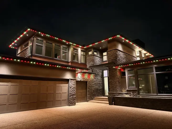 Calgary house lit up in team colours for game day using permanent LED lights